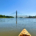 Kayak on river with bridge
